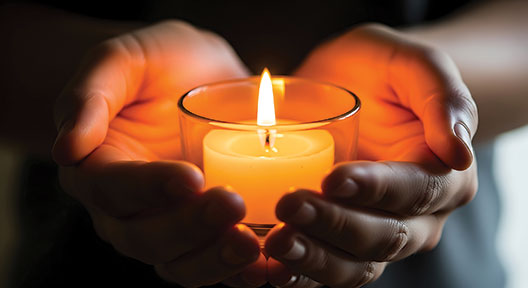 hands holding a candle hands holding a candle